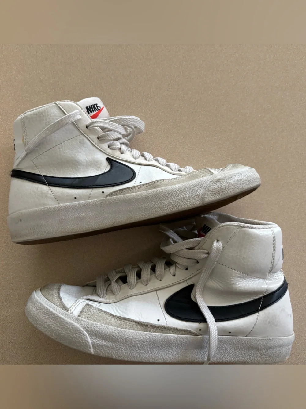 Nike Women’s White and Black High-Top Sneakers with Iconic Swoosh